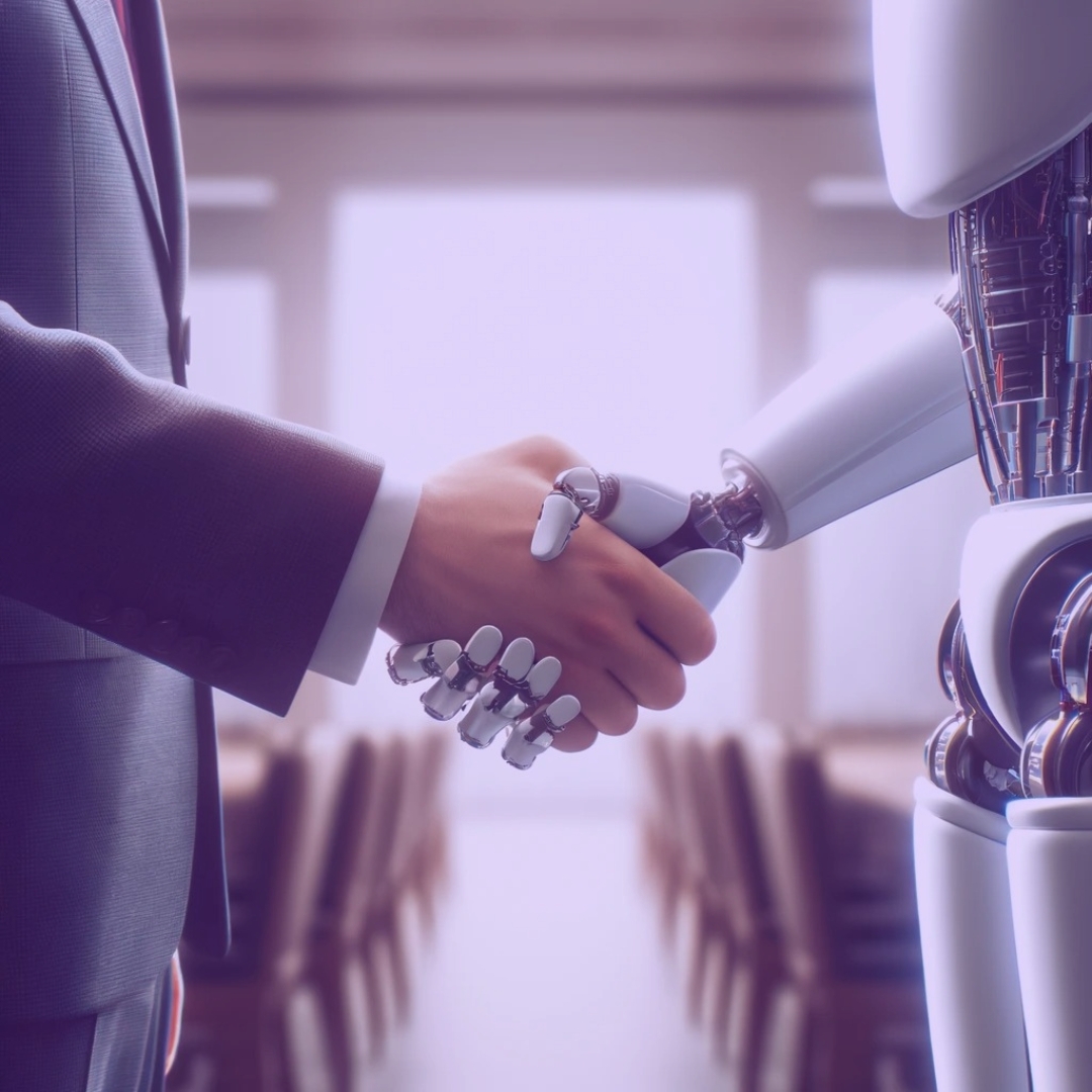 A human hand and a robot hand shaking hands